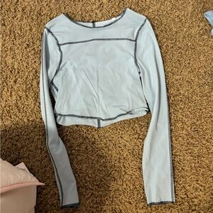 Long sleeve blue with black stitching cropped top from PacSun